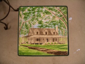 Cabin on tile 8"x8" set in wrought iron table